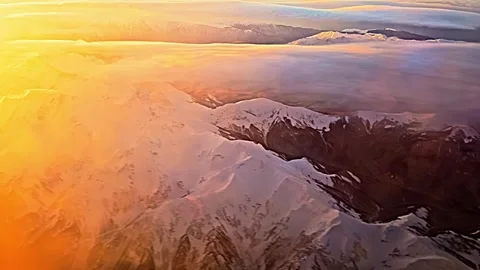 A mountain range with snow on it and the sun setting in the background Vídeo Stock 278146474