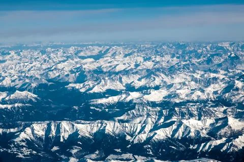 A mountain range with snow on it Stock Photos