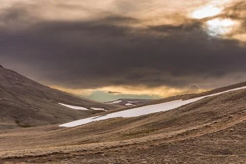 A mountain range with snow on the top and a cloudy sky in patagonian steppe Stock Photos