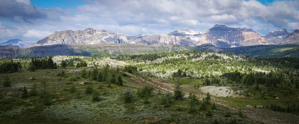 A mountain range with snow on the tops and a clear blue sky Stock Photos