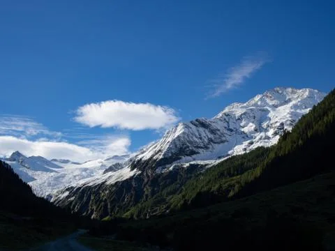 Mountain range snowcapped and blue sky Stock Photos