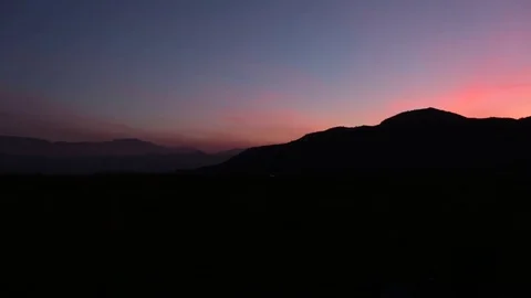 Mountain range at sunset Stock Footage 77048753