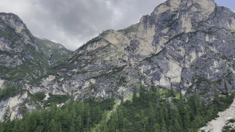 A Mountain Range that is Surrounded by Lush, Inviting Forests and Nature Stock Footage 280766453