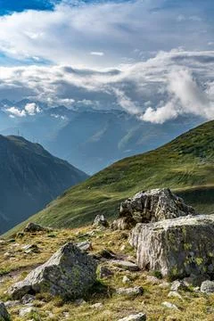 A mountain range in the Swiss Alps with a cloudy sky Stock Photos