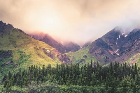 Mountain range with thick clouds above in the Denali National Park, Alaska Stock Photos