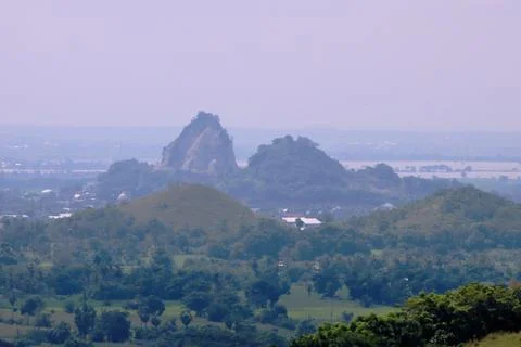 A mountain range with a town in the distance Stock Photos