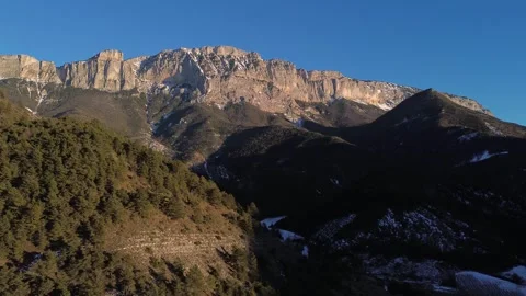 A mountain range with trees and a mountain Video stock 328615469