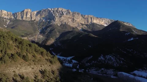 A mountain range with trees and a river Stock Footage 328615471