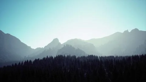 A mountain range with trees in the foreground and a blue sky in the backgroun Stock Illustration