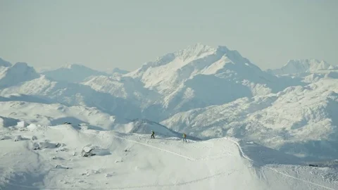Mountain Range with Two People Ski Touring along Ridge 動画素材 81683457