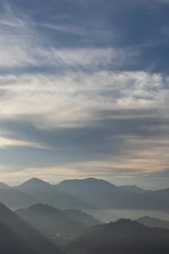 Mountain Range Under Cloudy Sky Stock Photos