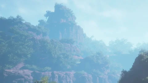 Mountain range under a mist with trees in the background Stock Footage 344100152