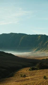 A mountain range with a valley in between Stock Photos