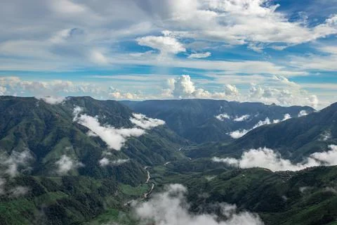 Mountain range valley filled with low clouds with dramatic sky at morning Фото