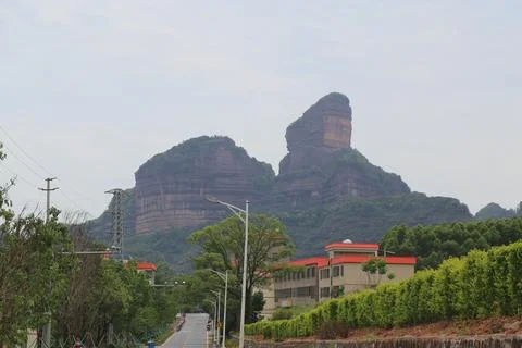 A mountain range is visible in the background of a city Stock Photos