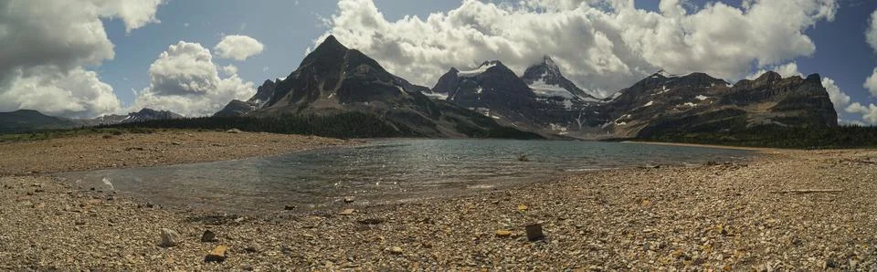 A mountain range is visible in the background with a lake in the foreground Stock Photos