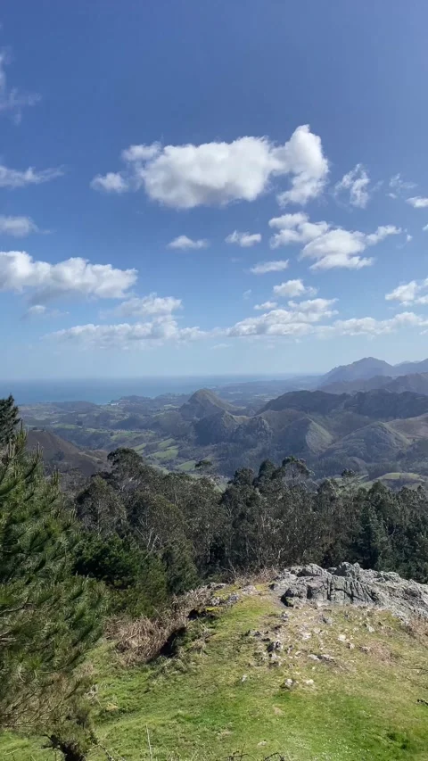 A mountain range is visible in the distance with a clear blue sky Stock Footage 298189820