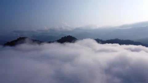 The mountain range with visible silhouettes seen through the fog in the morning Stock Footage 300745328