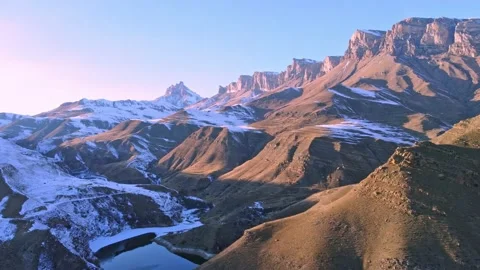 Mountain ranges offer a beautiful view of the plateau and the lake Stock Footage 168980211