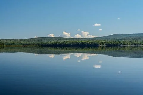 Mountain Reflection on lake with clear blue sky Stock Photos