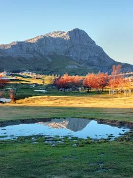 Mountain reflection on puddle. Gorbea, Basque Country Stock Photos