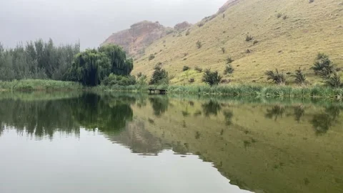 Mountain reflection in water Stock Footage 168760396