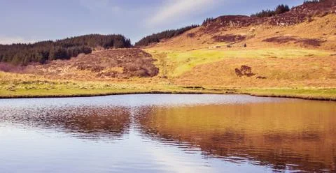 Mountain reflection on water - Isle of Skye, landscape of Scotland Stock Photos