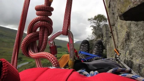Mountain rescue viewed from stretcher lowered horizontally down cliff 動画素材 70161830
