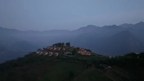 Mountain resort overlooking terraced rice fields and misty Hoang Lien Son mounta Stock Footage 340024886