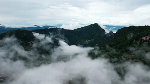 Mountain ridge and clouds in rural jungle bush forest. Ban Phahee Stock Footage 210677473
