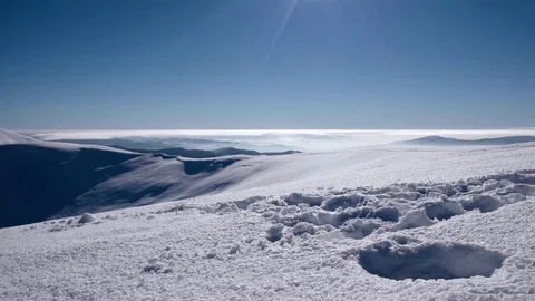 Mountain Ridge and Snow Covered Mountains and Rural Landscape in Winter Sunny 動画素材 72336740