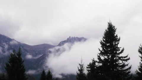 Mountain ridge covered by clouds and fog 動画素材 167667360