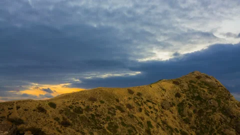 Mountain ridge in dense mist at the sunset time lapse scene Stock Footage 194164555