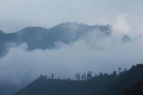 Mountain Ridge Emerging Above Dense Fog in Bromo National Park 스톡 사진