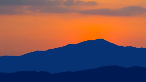 Mountain ridge silhouette at the dramatic twilight Stock Footage 313280615