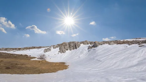 Mountain ridge in snow under a sparkle sun Stock Footage 243374384