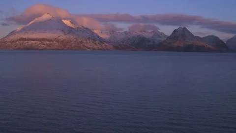 Mountain ridge at twilight in winter. Drone tilt up, 4K Stock Footage 88873816