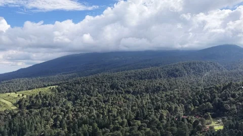 Mountain ridge under dramatic clouds, aerial drone, Mexico Stock Footage 348236442