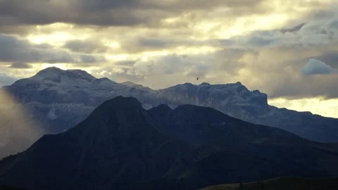 Mountain Ridges with Sun Rays and Distant Helicopter, Dolomites Video stock 316821225