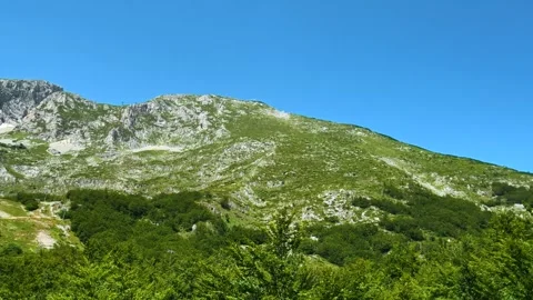 Mountain rises under clear blue sky. Savin Kuk peak, Montenegro Stock-Footage 342981123