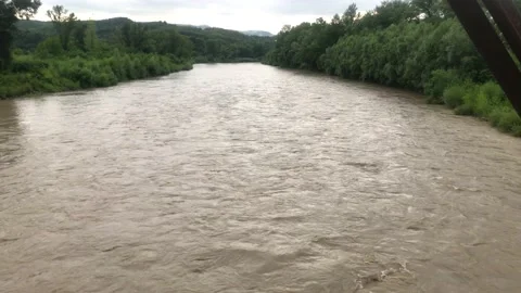 Mountain river after rain. Full-flowing mountain river after rain. river after Video stock 199095276