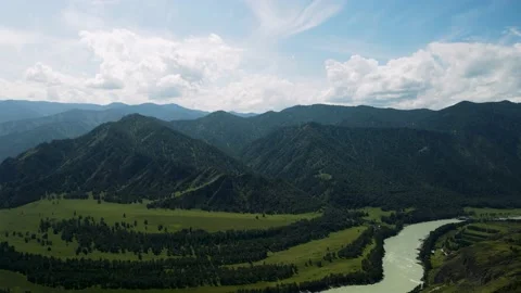 A mountain river against the background of high green mountains. Stock Footage 165972208