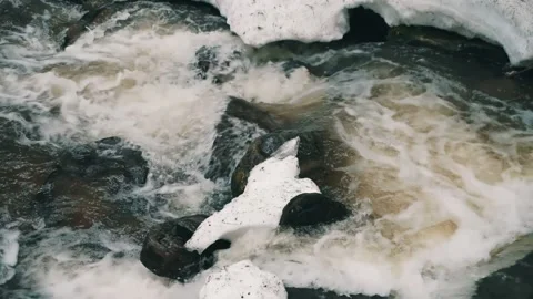 Mountain river among stones. Powerful flow of the river. Beautiful flow of the Stock Footage 238643320