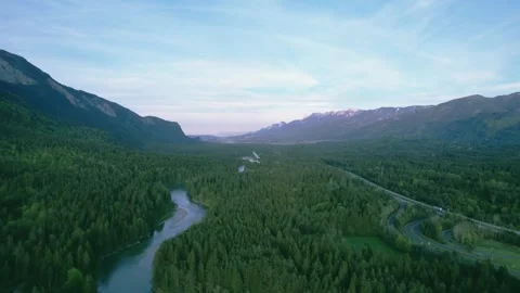Mountain river and expressway among coniferous forest in the Alps. Stock Footage 240859645