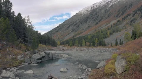 Mountain river and lake surrounded by stones and rocks. Stock Footage 117883458