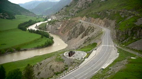 Mountain river and road. Down. Aerial Stock Footage 64144697