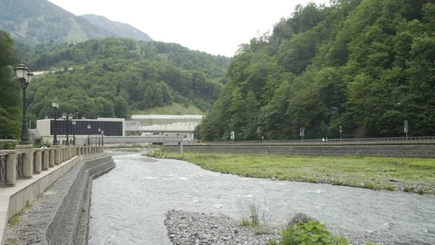 Mountain river between mountains covered with forest Stock Footage 96232637