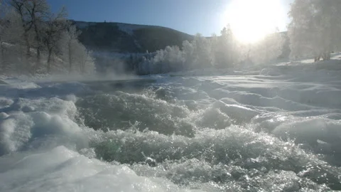 Mountain river is boiling in the frost Stock Footage 85715839