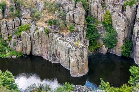 Mountain river in a canyon with stone cliffs with trees summer landscape. Stock Photos