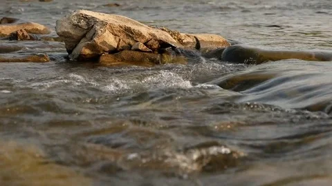 The mountain river in the Carpathians, the water flows along the rocks close-up Stock Footage 101678346